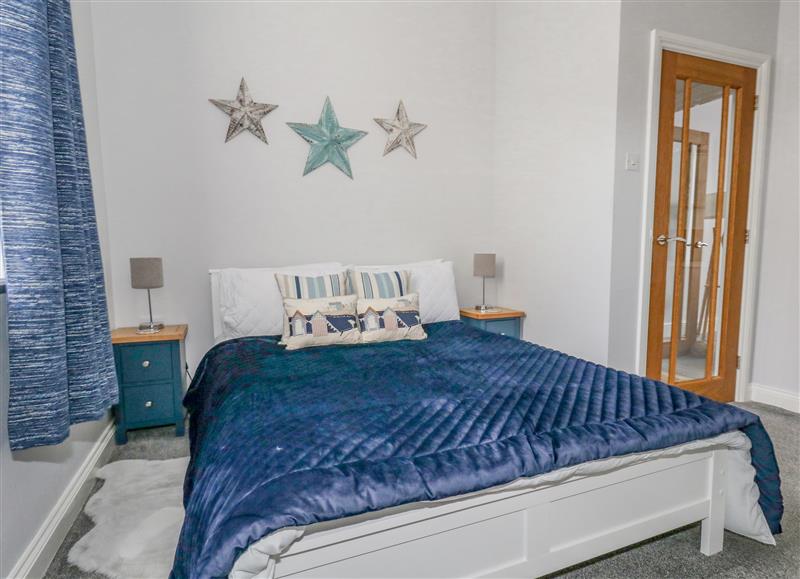 This is the bedroom at Tranquil Tides, Weymouth
