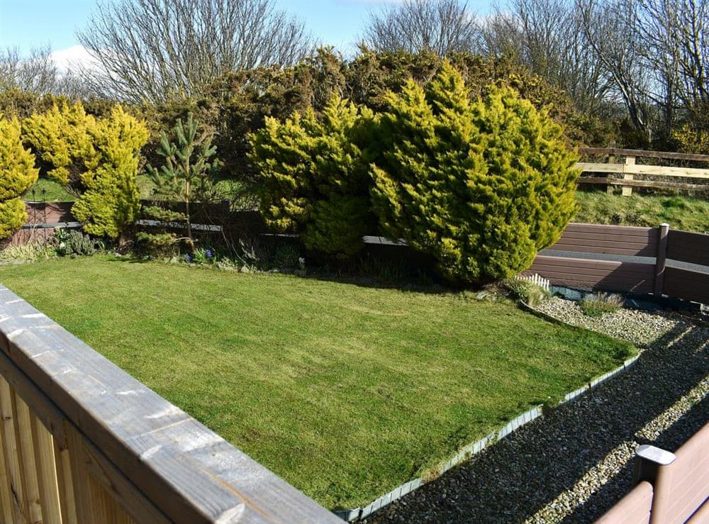 Small, enclosed, lawned garden at Tranquillity in Haverigg, near Millom, Cumbria