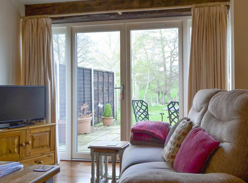 French doors from living room to patio area at The Cowshed, 