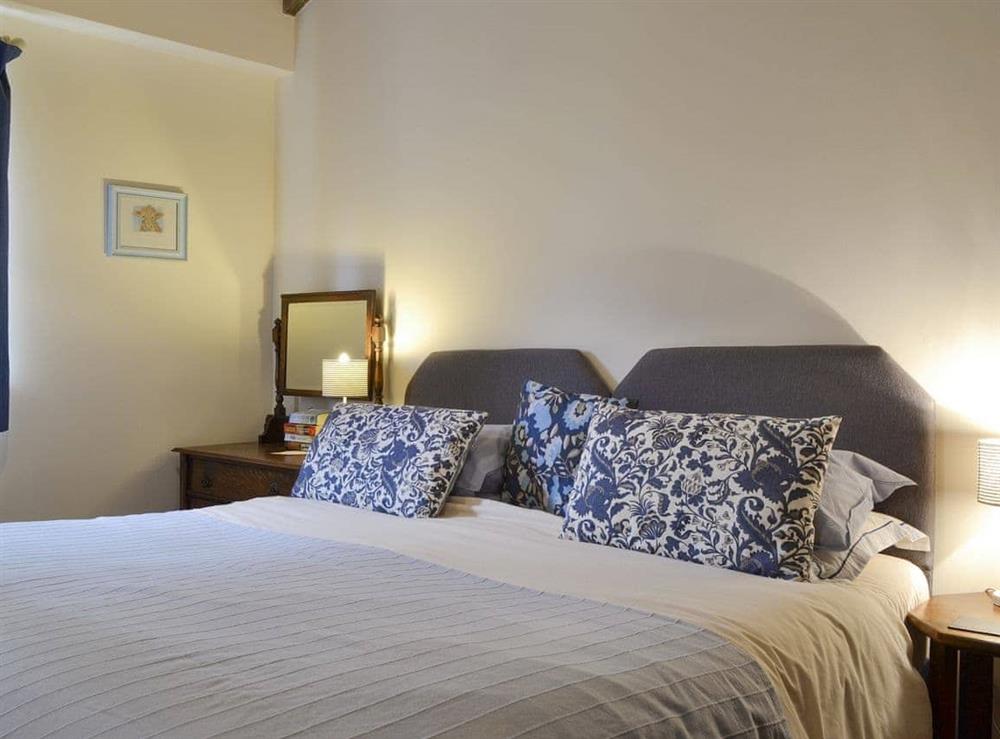 Peaceful double bedroom with en-suite at The Cowshed, 