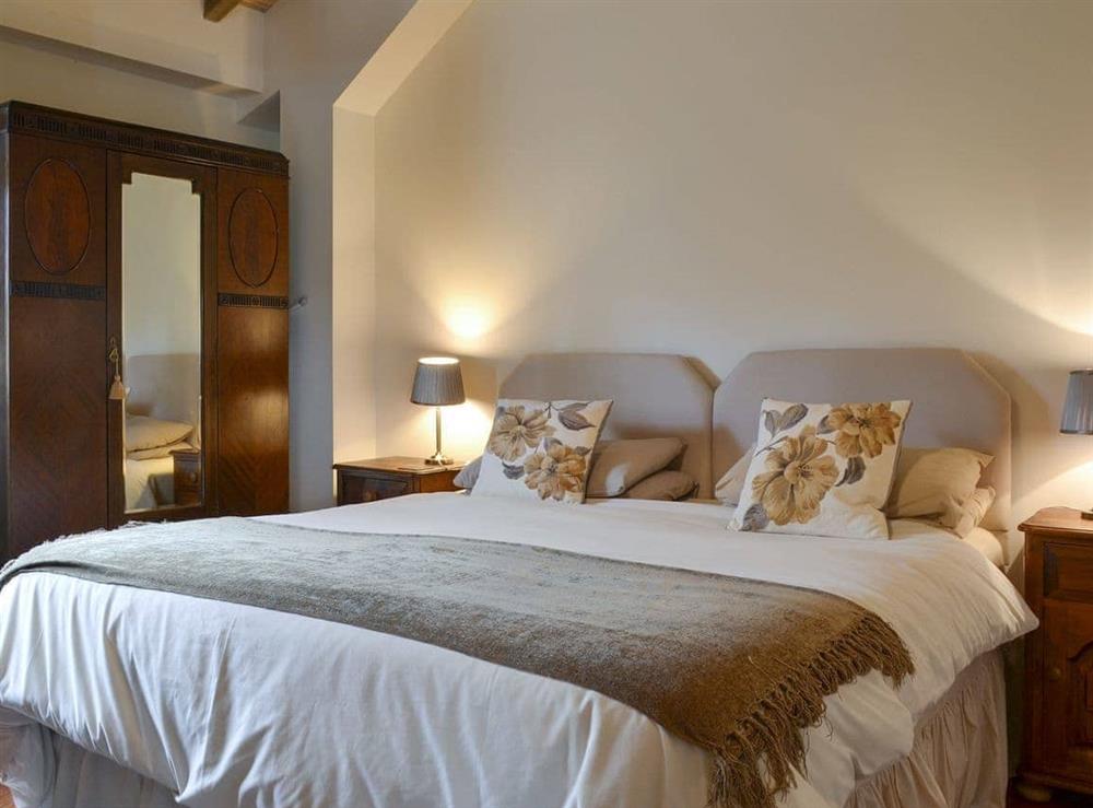 Relaxing double bedroom with en-suite at The Cowshed, 