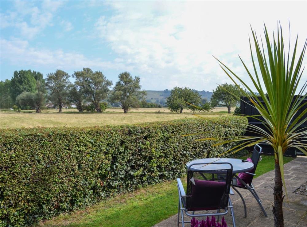Delightful sitting out area with wonderful rural views at Treacle Cottage in Hythe, Kent