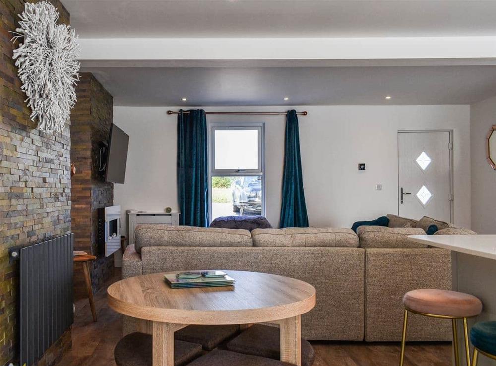 Open plan living space at Trebarber Cottage in Newquay, Cornwall