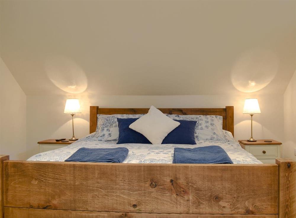 Comfortable double bedroom with king sized bed at Tree View Lodge in Uggeshall, Suffolk