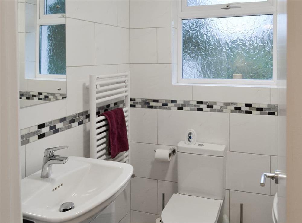 Ground floor bathroom with shower over bath at Treen in Lansallos, near Looe, Cornwall