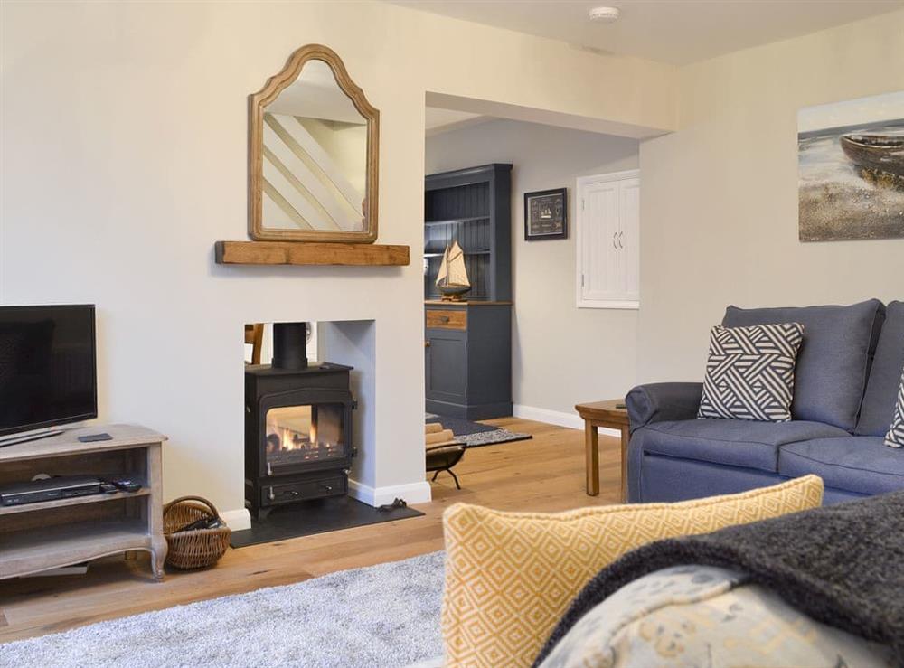 Welcoming living room with wood burner at Treen in Lansallos, near Looe, Cornwall