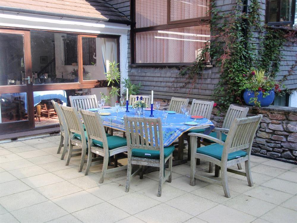 Terrace with table and chairs at Treetops in Moult Hill, Salcombe