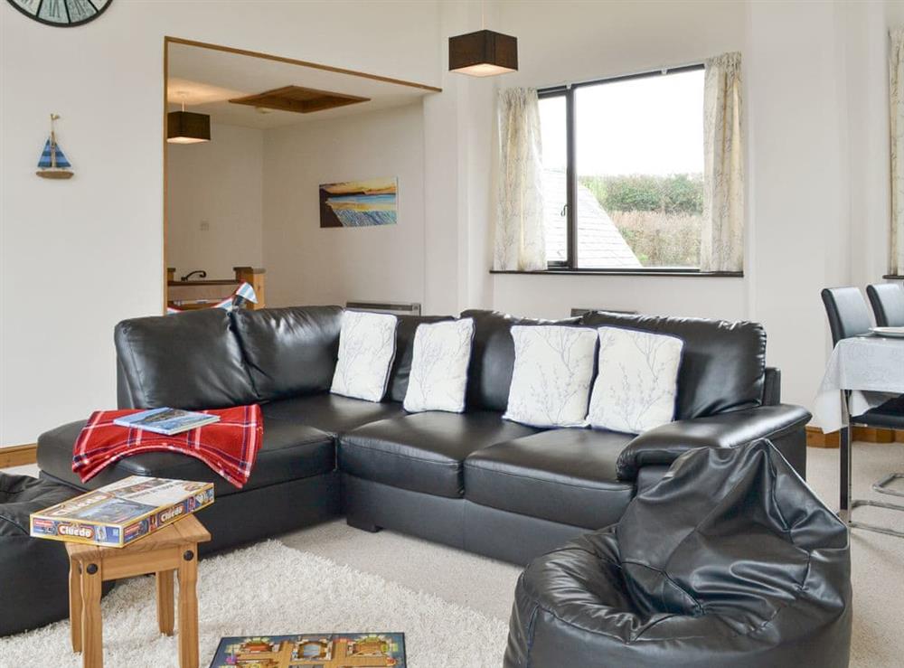 Spacious living and dining room at Treetops in Whitstone, near Bude, Cornwall
