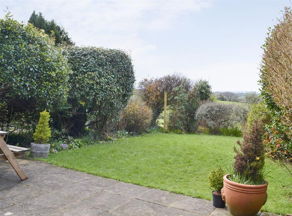 Well-maintained patio and garden area at Treetops in Whitstone, near Bude, Cornwall