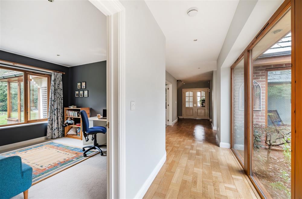 A wide corridors leads to the front hall and cloakroom