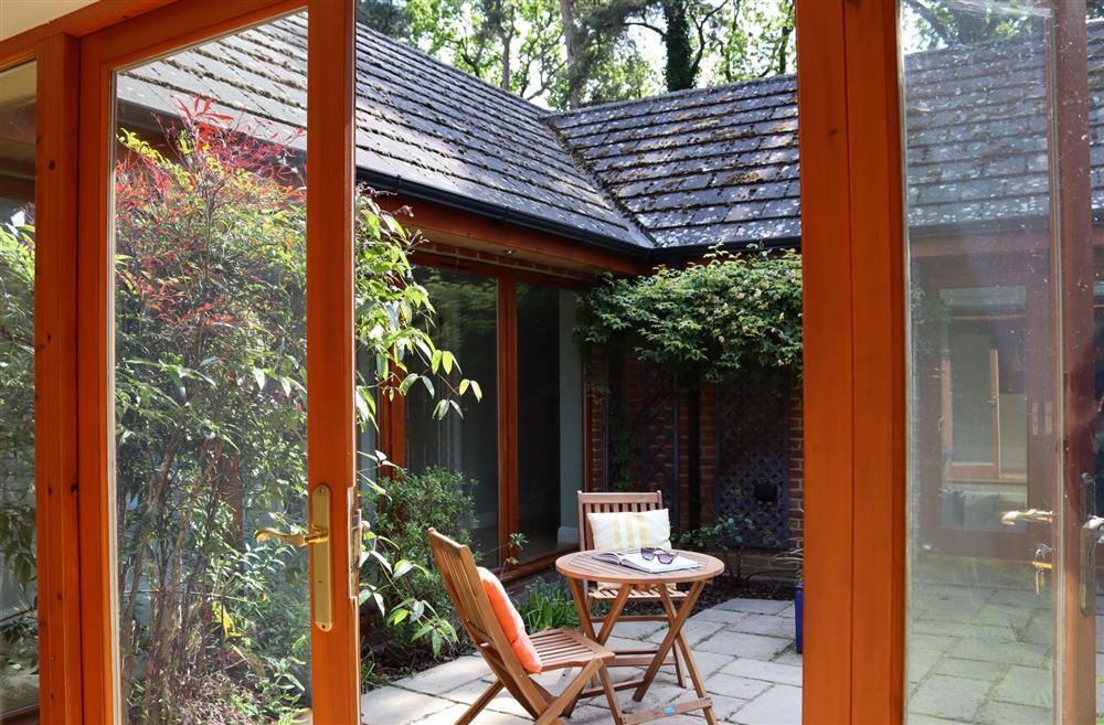 Doors lead through to the sunny courtyard