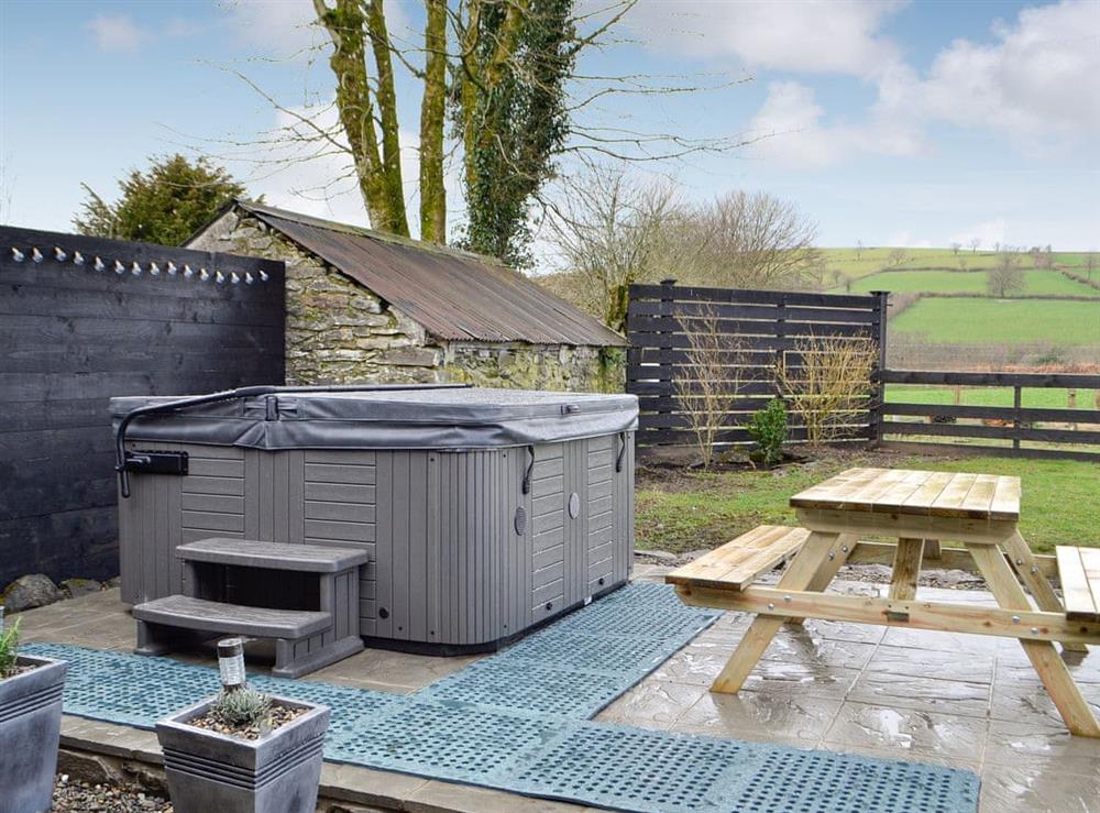 Outdoor area with hot tub at Trefechan in Pumpsaint, Dyfed