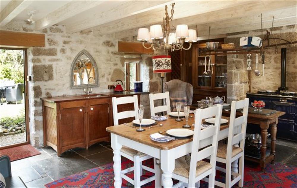 Characterful open plan kitchen and dining room with Aga (photo 2) at Tregadjack Barn, Tregathenan