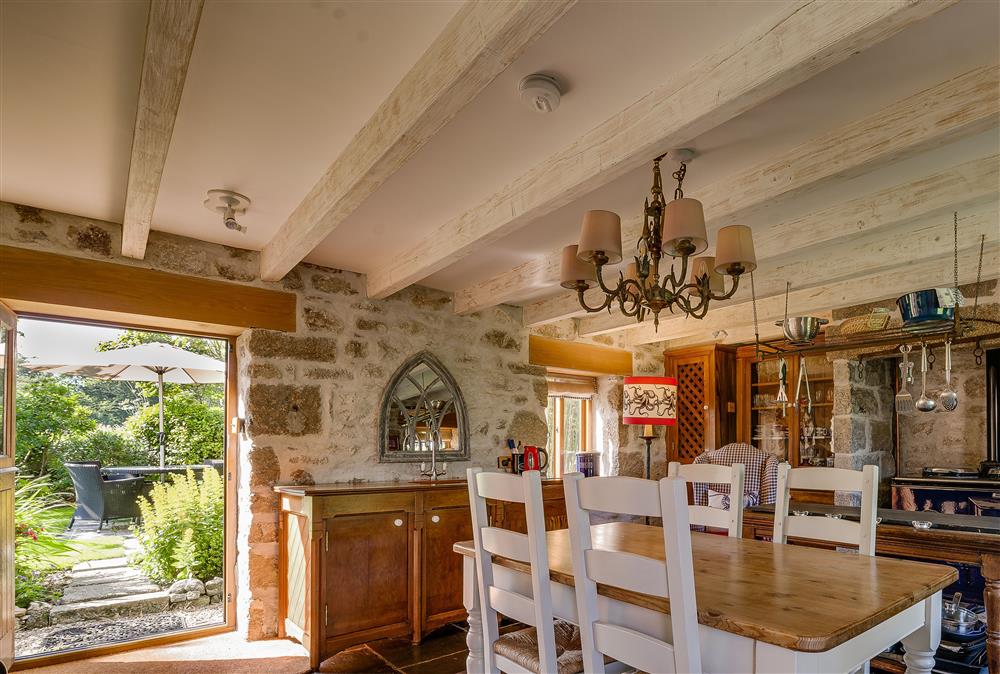 Characterful open-plan kitchen and dining room with Aga at Tregadjack Barn, Tregathenan