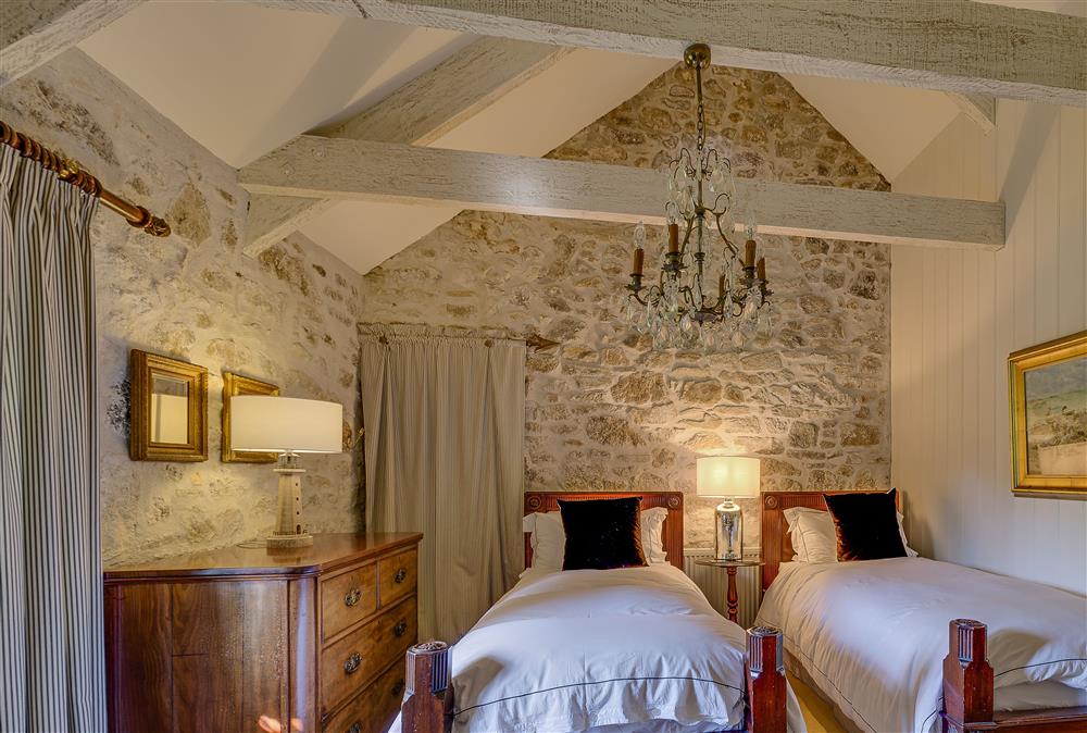 Twin bedroom with 3’ beds and en-suite shower room and WC at Tregadjack Barn, Tregathenan
