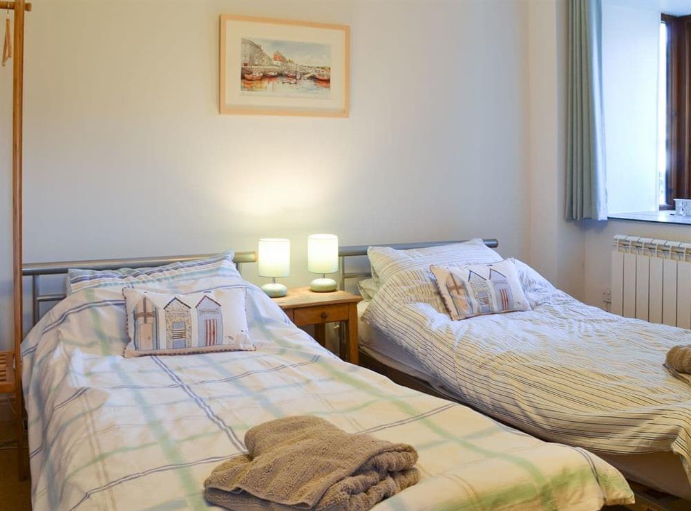 Pretty twin bedroom with en-suite at Tregella Farm Cottage in Near Padstow, Cornwall