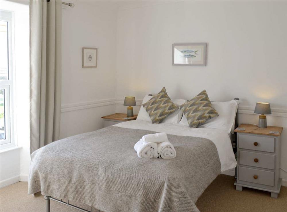 Comfortable double bedroom with en-suite at Treginegar Farmhouse in St Merryn, near Padstow, Cornwall