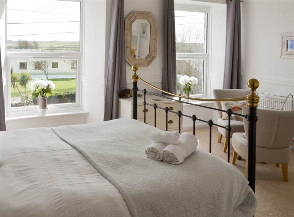 Relaxing double bedroom with en-suite at Treginegar Farmhouse in St Merryn, near Padstow, Cornwall