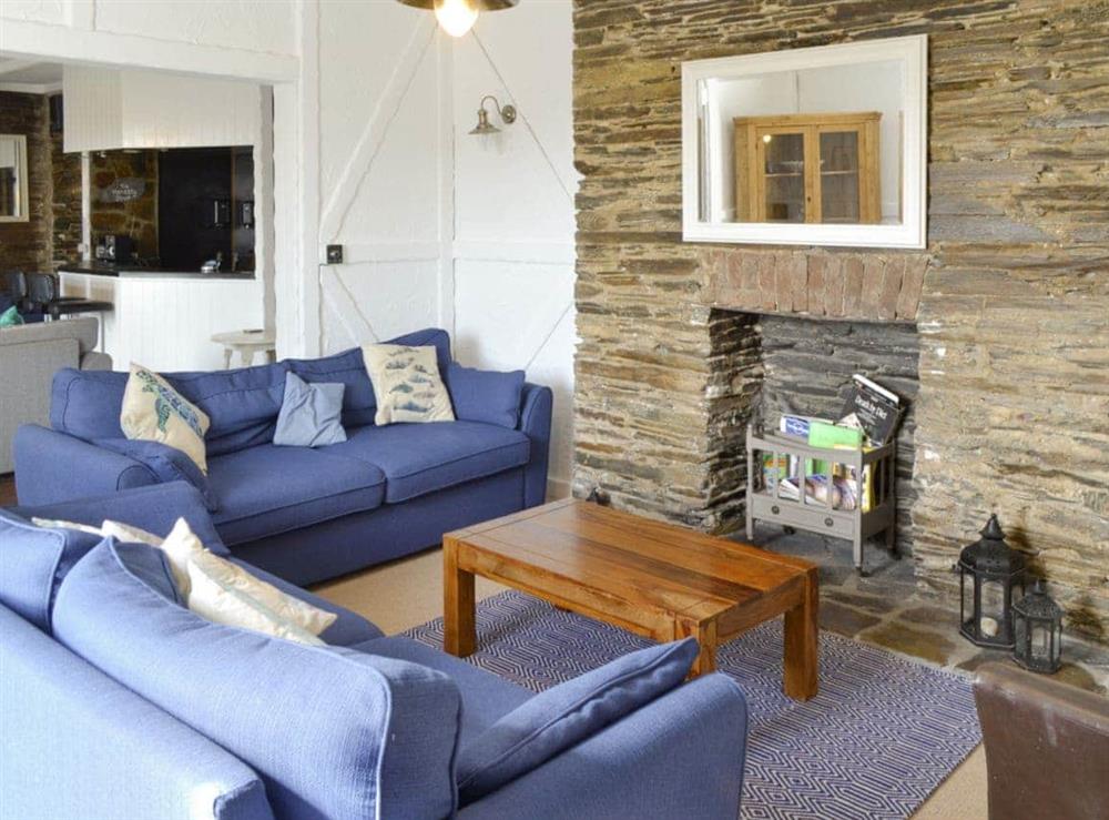 Spacious living area with open aspect to bar area at Treginegar Farmhouse in St Merryn, near Padstow, Cornwall