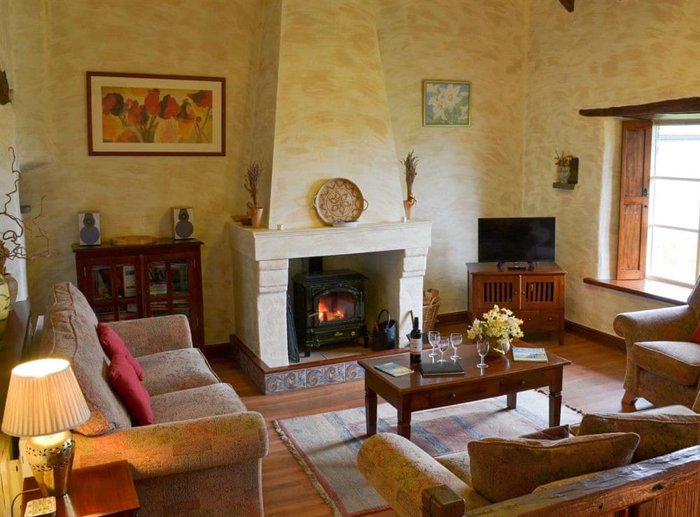 Living room with wood burner at Provence, 