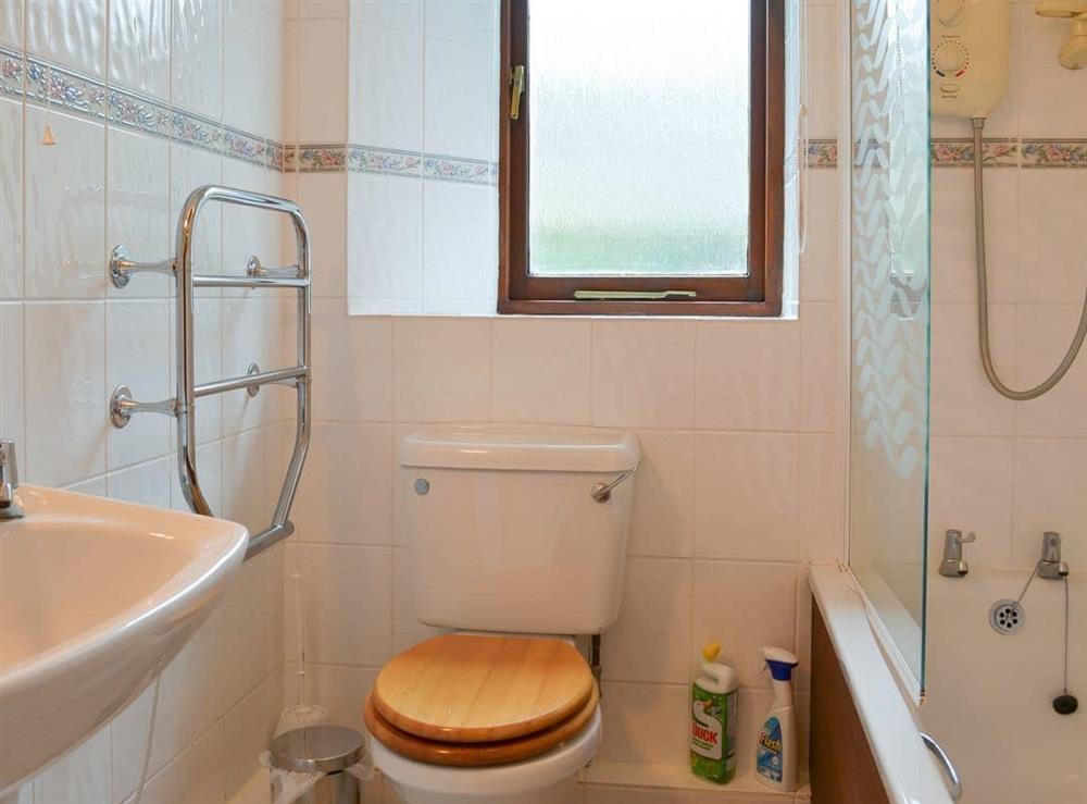 Bathroom with shower over the bath at Stable, 