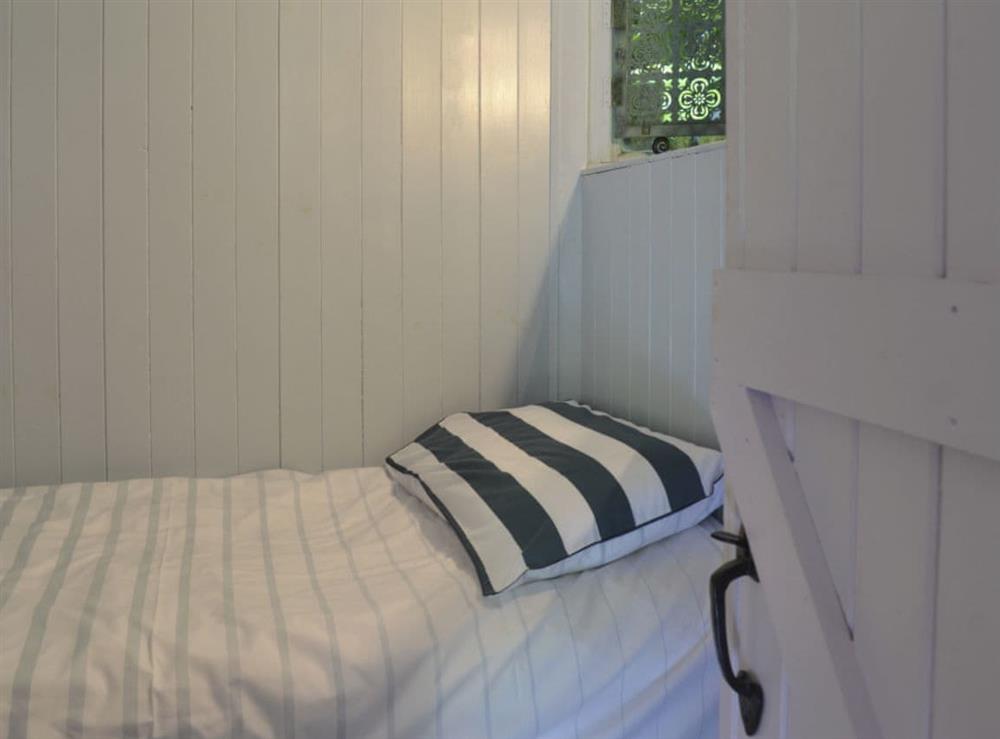 Tranquil bedroom with single bed at Beach Retreat, 