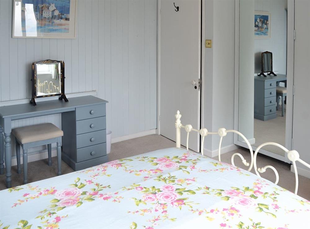 Attractive bedroom with picturesque coastal views at Rivendell, 