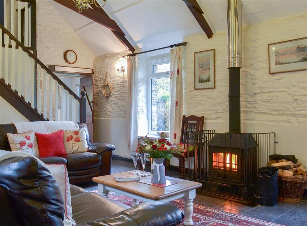 Living room with wood burner at Trenay Barn Cottage in St Neot, near Liskeard, Cornwall