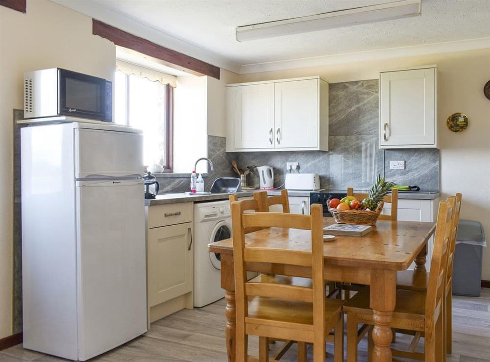 Fully appointed kitchen with convenient dining area at Haywain, 