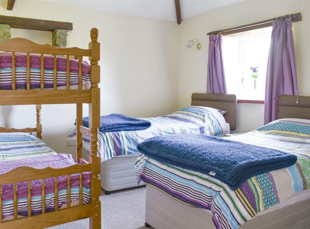 Light and airy multi-sleep bedroom at Owls Roost, 