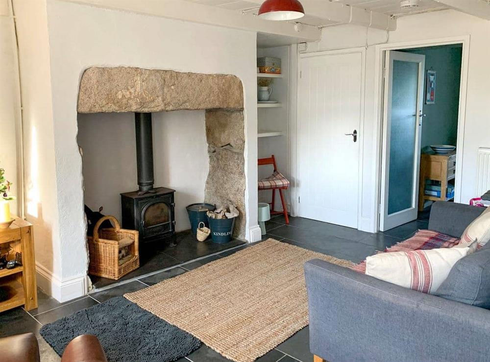 Cosy living room with wood burner at Treplevna in Pendeen, Cornwall