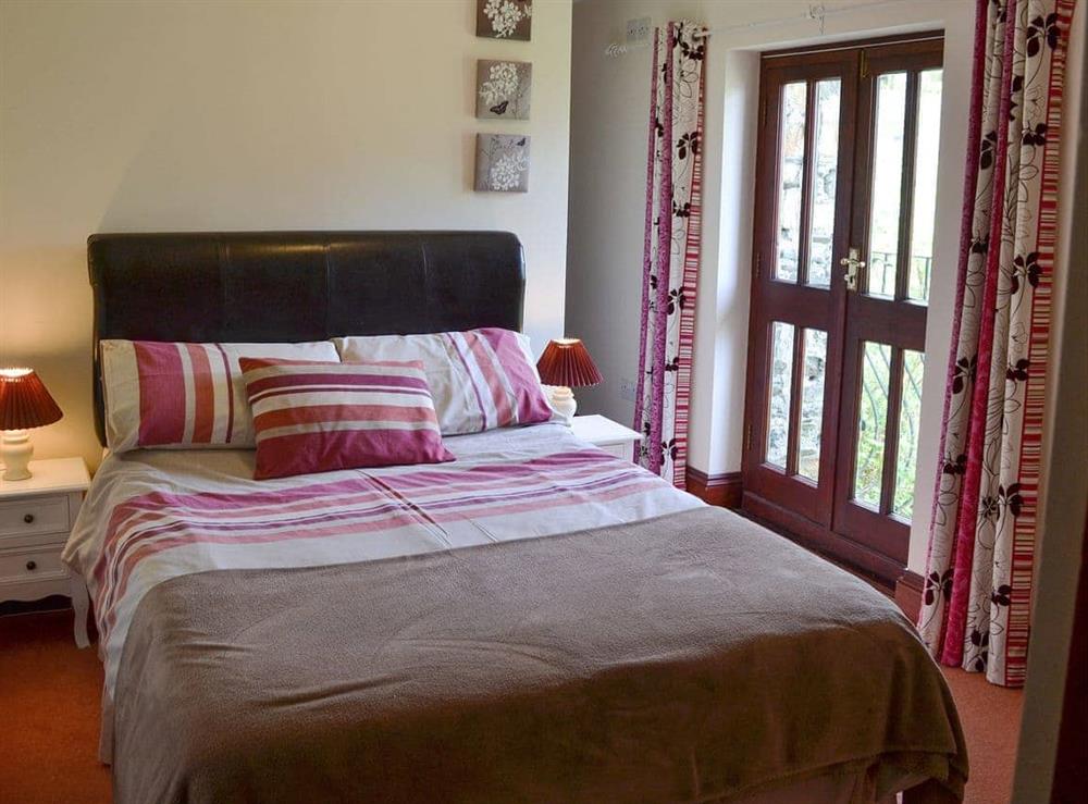 Comfy double bedroom at Trescowthick Barn in St Newlyn, Cornwall