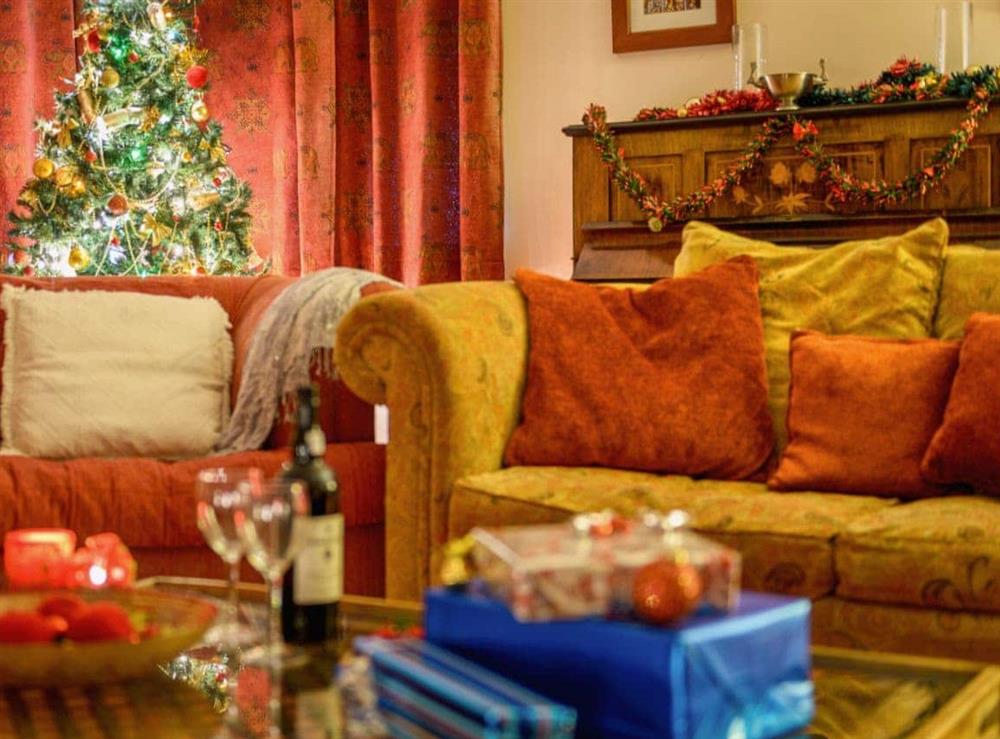 Living room decorated for Christmas at Trescowthick Barn in St Newlyn, Cornwall