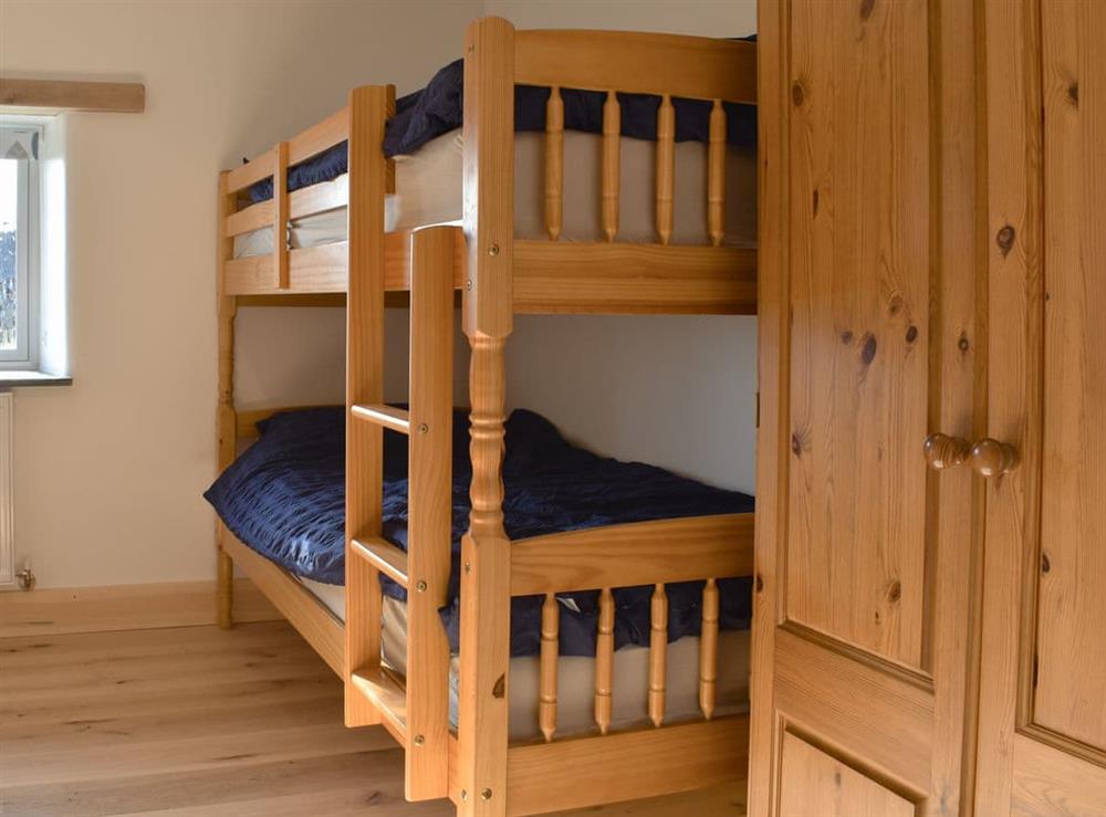 Bunk bedroom at Treskilling Barn, in Bodmin, Cornwall