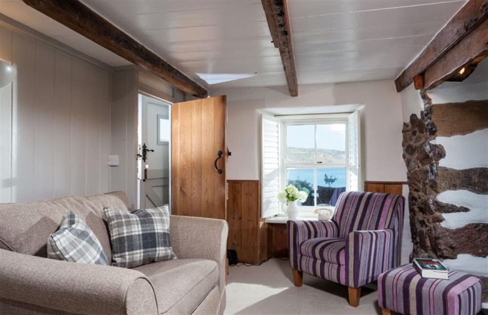 Trevarrow Cottage, Cornwall: A shuttered window frames the lovely sea view at Trevarrow Cottage, Coverack
