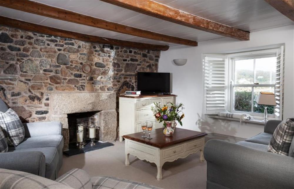 Trevarrow Cottage, Cornwall: The second sitting room with television and exposed beams at Trevarrow Cottage, Coverack