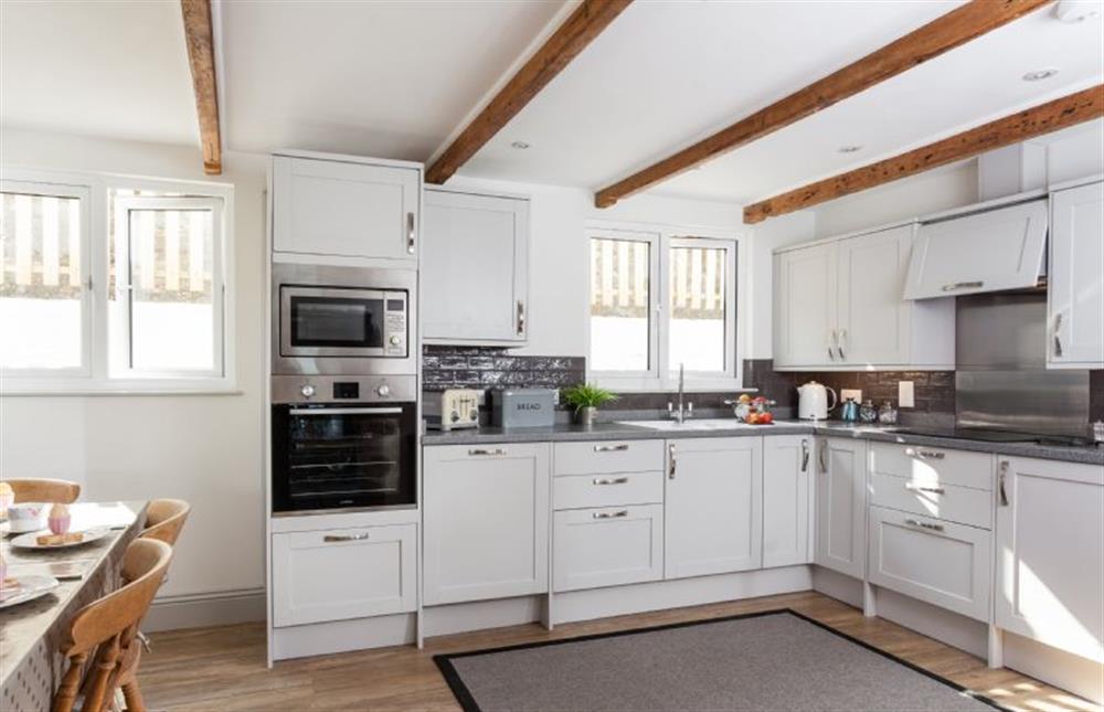Trevarrow Cottage, Cornwall: Well-equipped kitchen, all set for preparing family meals at Trevarrow Cottage, Coverack