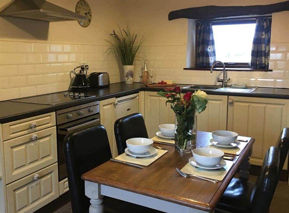 Fully-equipped fitted kitchen with dining area at Trevena Star in Rosedale, near Pickering, North Yorkshire