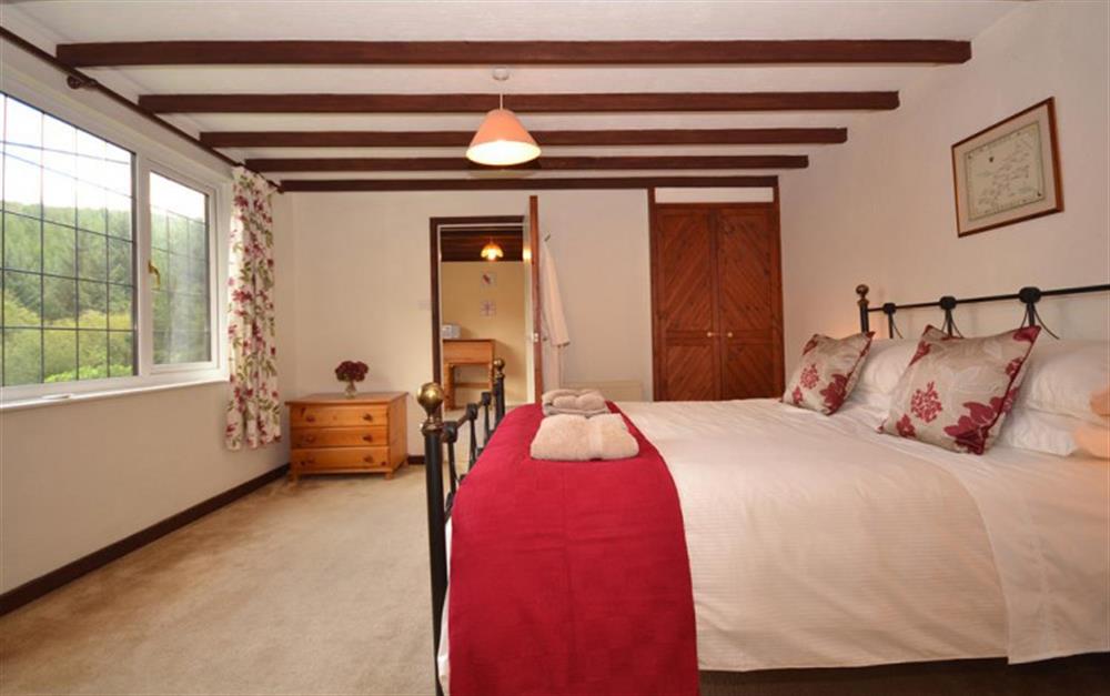 The master bedroom on the first floor, looking towards the adjoining room. at Treverbyn Vean Stable in St Neot