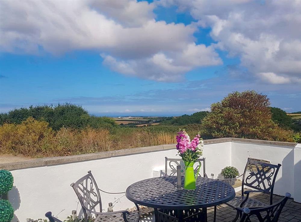 Patio with far reaching views at Trevone in St Merryn, near Padstow, Cornwall