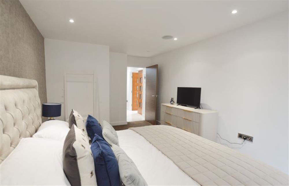 Bedroom one with a super-king size bed and walk-in wet room (photo 3) at Trevose Penthouse, Newquay
