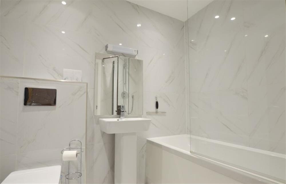 Family bathroom with bath, wash basin and WC at Trevose Penthouse, Newquay