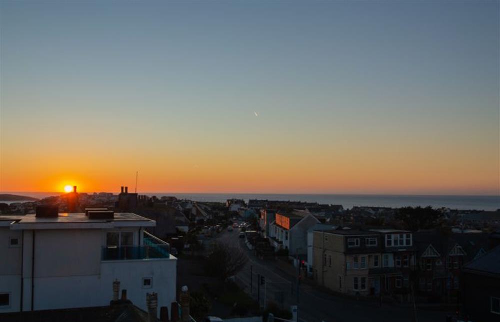 Watch the sunset go down from the luxury of the top floor balcony (photo 3) at Trevose Penthouse, Newquay