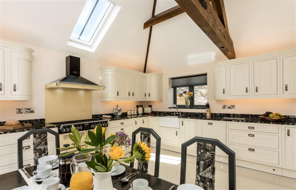 The dining table in the kitchen seating 8 at Trewethan Barn, Tintagel