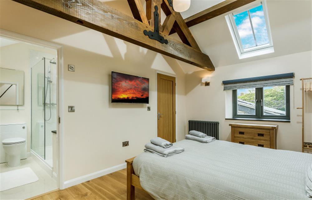 The master bedroom with en-suite at Trewethan Barn, Tintagel