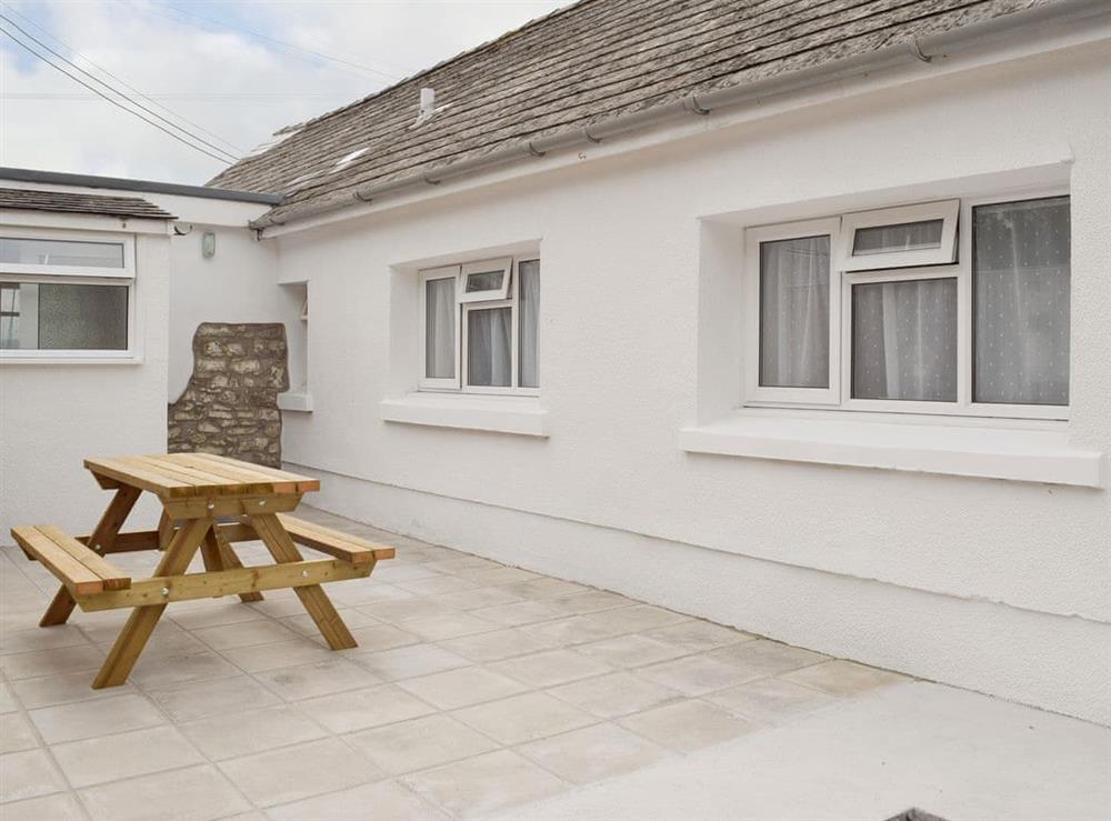 Enclosed courtyard with outdoor furniture at Trewindsor in Llandysul, Ceredigion, Dyfed