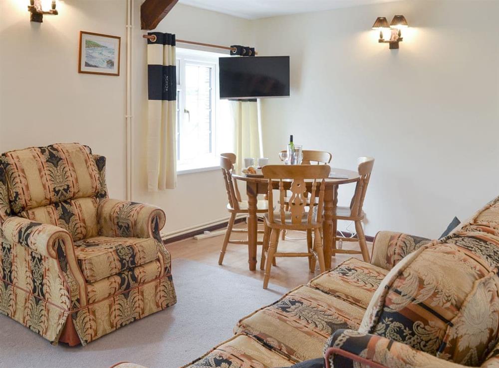 Attractive living and dining area at Manor Cottage, 