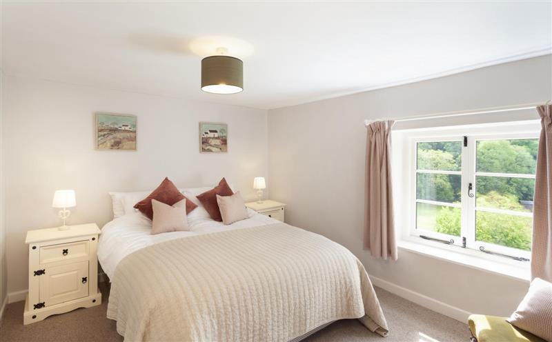A bedroom in Trinity Cottage at Trinity Cottage, Roadwater