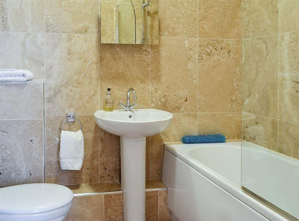 En-suite Bathroom with shower over bath at Trinity House in Ulverston, Cumbria