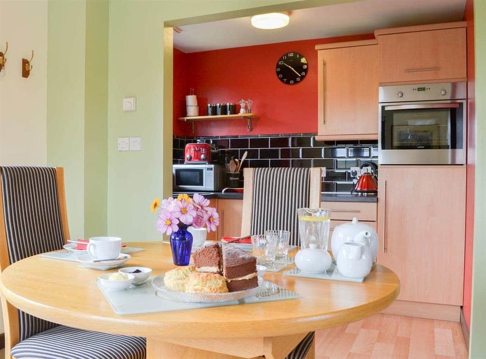 Kitchen and adjacent dining area at Tripp Cottage in St Neot, near Liskeard, Cornwall